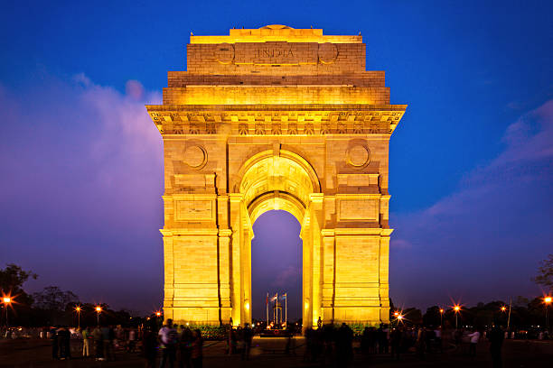 illuminated india gate in dehli at dusk